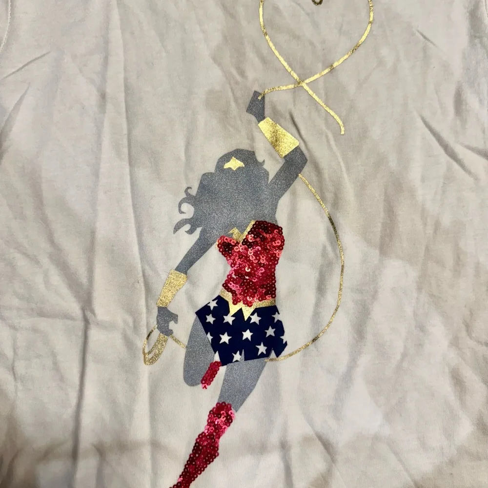Like new GAP Cream Long Sleeve Shirt with Wonder Woman Design - Picture 2 of 4